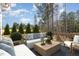 Inviting deck with comfortable seating and beautiful wooded views at 600 Darian Woods Drive,, Holly Springs, NC 27540