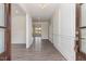 Bright and spacious entryway with hardwood floors and elegant wainscoting at 600 Darian Woods Drive,, Holly Springs, NC 27540