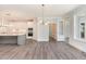 Modern kitchen with white cabinets, marble countertops, and large island at 600 Darian Woods Drive,, Holly Springs, NC 27540