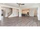 Open floor plan with hardwood floors, kitchen, and staircase at 600 Darian Woods Drive,, Holly Springs, NC 27540