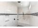 Spa-like shower with marble tile, built-in seat, and rainfall showerhead at 600 Darian Woods Drive,, Holly Springs, NC 27540