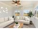 Bright sunroom with comfortable seating and plenty of natural light at 600 Darian Woods Drive,, Holly Springs, NC 27540
