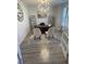 Bright home office with hardwood floors, built-in shelving, and two chairs at 5011 Manderleigh Dr, Knightdale, NC 27545