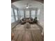 Bright sunroom features a comfy sofa and large windows at 5011 Manderleigh Dr, Knightdale, NC 27545