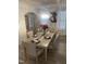 Elegant dining room with a large table, chandelier, and hardwood floors at 5011 Manderleigh Dr, Knightdale, NC 27545