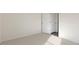 Empty bedroom with carpet flooring and a partially open door leading to another room at 91 Calebs Corner Pl, Spring Lake, NC 28390