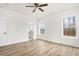 Bedroom with hardwood floors, ceiling fan and access to bathroom at 219 Sequoia Dr, Louisburg, NC 27549