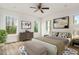 Bright bedroom with hardwood floors and ceiling fan at 219 Sequoia Dr, Louisburg, NC 27549