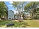 Back of house, large yard with chicken coop at 214 College St, Oxford, NC 27565