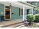 Inviting front porch with wooden floors and columns at 214 College St, Oxford, NC 27565