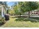 Quiet street with mature trees and charming homes at 214 College St, Oxford, NC 27565