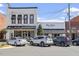 Two commercial buildings on Main Street, one housing a hair salon and the other a nutrition business at 214 College St, Oxford, NC 27565