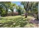 Spacious backyard with a chicken coop and patio area at 214 College St, Oxford, NC 27565