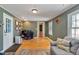 Home office with hardwood floors and built-in shelving at 214 College St, Oxford, NC 27565