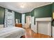 Bedroom with wood floors and built-in shelving at 214 College St, Oxford, NC 27565