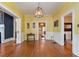 Bright dining room with hardwood floors and fireplace at 214 College St, Oxford, NC 27565