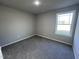 Bright bedroom featuring carpet flooring and window at 98 Lotus Ave, Smithfield, NC 27577