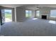 Spacious living room with a fireplace and large windows at 98 Lotus Ave, Smithfield, NC 27577