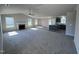 Open living room and kitchen with a fireplace and island at 98 Lotus Ave, Smithfield, NC 27577