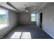 Spacious main bedroom with ceiling fan and carpet at 98 Lotus Ave, Smithfield, NC 27577