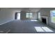 Spacious living room with a fireplace and large windows at 98 Lotus Ave, Smithfield, NC 27577