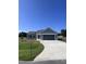 Gray house with attached garage and concrete driveway at 98 Lotus Ave, Smithfield, NC 27577