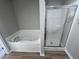 Bathroom with soaking tub and shower at 98 Lotus Ave, Smithfield, NC 27577