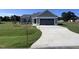Gray house with attached garage and concrete driveway at 98 Lotus Ave, Smithfield, NC 27577