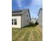 House exterior showcasing solar panels and a large backyard at 1565 Sage Treee Dr Dr, Zebulon, NC 27597