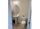 Clean half bathroom with pedestal sink and toilet at 1565 Sage Treee Dr Dr, Zebulon, NC 27597
