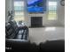 Living area with fireplace and comfortable seating at 1565 Sage Treee Dr Dr, Zebulon, NC 27597