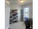 Bright bedroom with window, carpeted floor, and ample closet space at 1565 Sage Treee Dr Dr, Zebulon, NC 27597