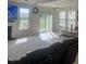 Open living space with access to kitchen and patio at 1565 Sage Treee Dr Dr, Zebulon, NC 27597