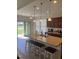 Eat-in kitchen features an island with seating and a view of the backyard at 1565 Sage Treee Dr Dr, Zebulon, NC 27597