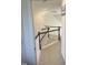 Upstairs hallway with dark wood railings and carpeted floors at 1565 Sage Treee Dr Dr, Zebulon, NC 27597