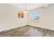 Dining room with hardwood floors, chandelier and kitchen view at 2818 Gross Ave, Wake Forest, NC 27587