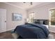 Comfortable bedroom with a double bed and wood flooring at 1845 N Main St, Roxboro, NC 27573