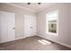 Simple bedroom with hardwood floors and ample closet space at 1849 N Main St, Roxboro, NC 27573