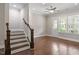 Hardwood floor living room with access to balcony at 836 Bankston Woods Way, Raleigh, NC 27609