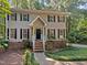 Two-story house with gray siding and brick base at 114 Canterfield Rd, Cary, NC 27513