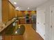 Modern kitchen featuring granite countertops and stainless steel appliances at 114 Canterfield Rd, Cary, NC 27513