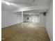 Finished basement featuring sliding glass doors and carpeted floor at 114 Canterfield Rd, Cary, NC 27513