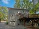 Two-story house with large deck, attached garage, and driveway at 114 Canterfield Rd, Cary, NC 27513