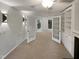 Open living room with fireplace and built-in shelving at 114 Canterfield Rd, Cary, NC 27513
