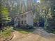Two-story house with gray siding and brick base at 114 Canterfield Rd, Cary, NC 27513