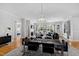 Open concept living space with hardwood floors, fireplace, and access to the bedroom at 620 Wade Ave # 301, Raleigh, NC 27605