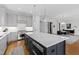 Modern kitchen with large island and stainless steel appliances at 620 Wade Ave # 301, Raleigh, NC 27605