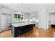 Spacious kitchen with island, stainless steel appliances, and marble counters at 620 Wade Ave # 301, Raleigh, NC 27605