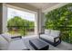 Private balcony with comfortable seating and treetop views at 620 Wade Ave # 301, Raleigh, NC 27605