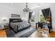 Spacious bedroom with a large bed, workspace, and hardwood floors at 620 Wade Ave # 301, Raleigh, NC 27605